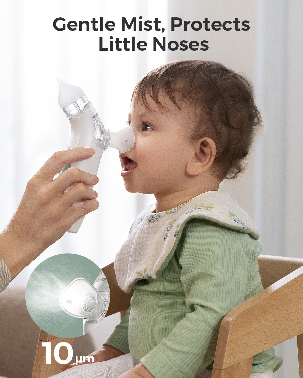 Momcozy nasal aspirator gently spraying mist into baby's nose. Gentle mist protects little noses. 10µm particle size.
