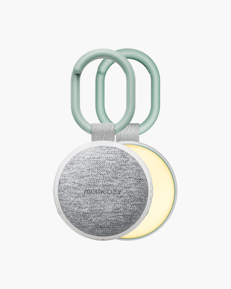 Translation missing: pl.Momcozy Portable Sound Machine featuring a light gray speaker, white frame, green handle and adjustable light function
